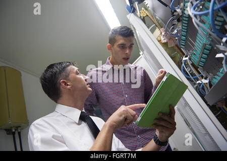 network engineers in server room Stock Photo
