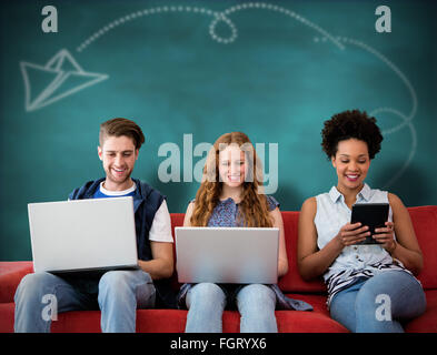 Composite image of creative team using laptops and digital tablet Stock Photo