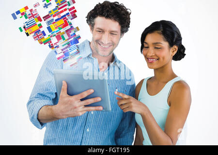 Composite image of smiling business people using digital tablet Stock Photo