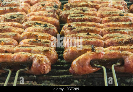 Buenos Aires Argentina cooking food sausages  on fire Gaucho cowboy ranch for tourists outside city called Don Silvano Ranch Stock Photo