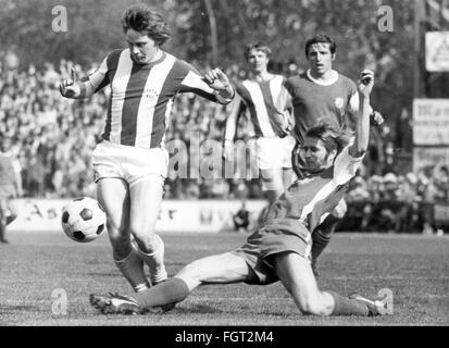 sports,football,games,Germany,national league,season 1970 / 1971,29th match day,game Rot-Weiss Essen versus Hertha BSC(0:3),Georg-Melches-Stadion,Essen,1.5.1971,defender Peter Czernotzky(Essen)stops striker Arno Steffenhagen(Berlin),Rot Weiss,football match,soccer match,football matches,footballer,footballers,kicker,football player,football players,action,act,actions,acts,assaults,assault,attack,offensive move,attacks,offensive moves,defences,defenses,defense,defence,leg lay,sliding tackle,running,run,runs,ball,playi,Additional-Rights-Clearences-Not Available Stock Photo