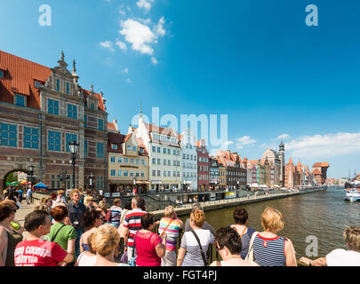 Gdansk, Poland - 18 May, 2013: City of Gdansk. Old town and famous crane, Polish Zuraw. View from bridge with crowd of tourists Stock Photo