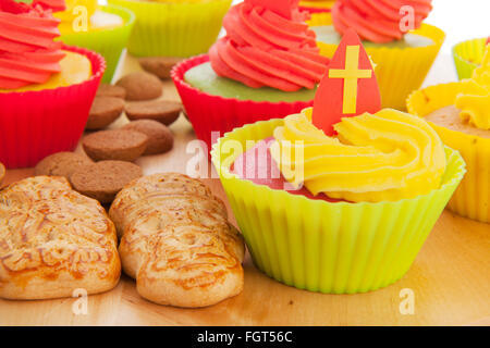 Home made Sinterklaas cupcakes with pepernoten and meringue Stock Photo