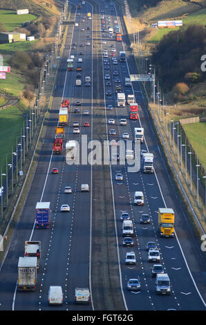 heavy traffic travelling on the m62 near moss moor huddersfield yorkshire uk Stock Photo