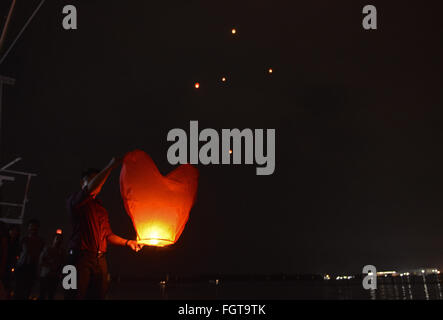 Feb. 22, 2016 - Port Klang, Selangor, Malaysia - Malaysian Chinese light up the flying lantern during Chap Goh Mei celebration  in Port Klang outside Kuala Lumpur Malaysia on 22 February 2016. Chap Goh Mei is the final day of Chinese New Year, also known as the Oriental Valentine's Day. Young maidens believed that by throwing mandarin oranges into the sea or a lake or pool would find themselves a good husband. (Credit Image: © Kepy via ZUMA Wire) Stock Photo