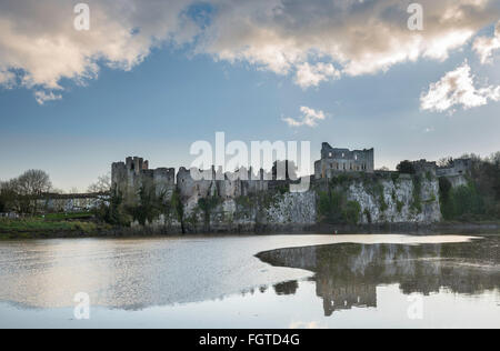 Chepstow Castle reflected in the River Wye at high tide. Stock Photo