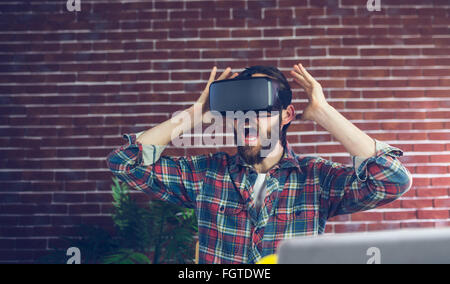Shocked editor using 3D video glasses Stock Photo