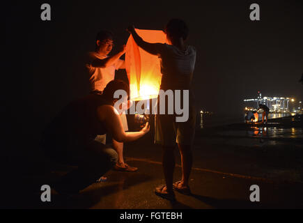 Port Klang, Selangor, Malaysia. 22nd Feb, 2016. Malaysian Chinese light up the flying lantern during Chap Goh Mei celebration in Port Klang outside Kuala Lumpur Malaysia on 22 February 2016. Chap Goh Mei is the final day of Chinese New Year, also known as the Oriental Valentine's Day. Young maidens believed that by throwing mandarin oranges into the sea or a lake or pool would find themselves a good husband. © Kepy/ZUMA Wire/Alamy Live News Stock Photo