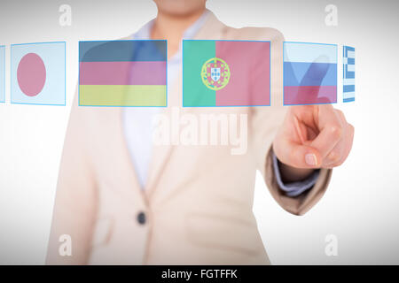 Composite image of businesswoman pointing Stock Photo