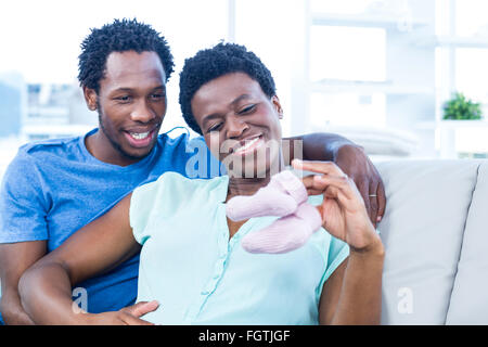 Pregnant woman and man baby shoes. Selective focus. nature Stock