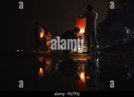 Feb. 22, 2016 - Port Klang, Selangor, Malaysia - Malaysian Chinese light up the flying lantern during Chap Goh Mei celebration  in Port Klang outside Kuala Lumpur Malaysia on 22 February 2016. Chap Goh Mei is the final day of Chinese New Year, also known as the Oriental Valentine's Day. Young maidens believed that by throwing mandarin oranges into the sea or a lake or pool would find themselves a good husband. (Credit Image: © Kepy via ZUMA Wire) Stock Photo