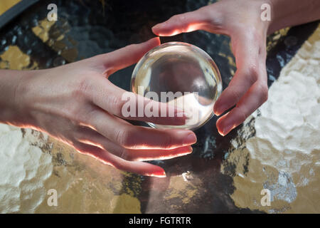 Fortune teller using crystal ball Stock Photo