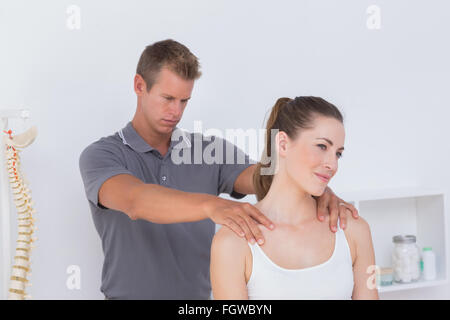 Doctor examining his patient neck Stock Photo