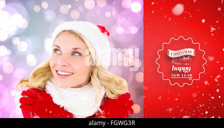 Composite image of happy festive blonde Stock Photo