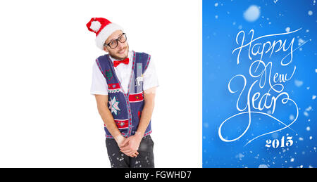 Composite image of geeky hipster in santa hat Stock Photo