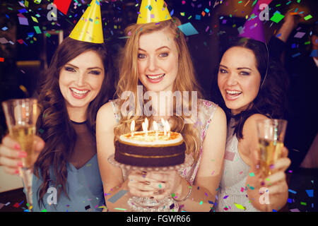 Composite image of attractive friends celebrating a birthday Stock