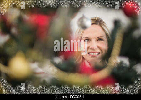 Festive blonde hanging bauble on christmas tree Stock Photo - Alamy