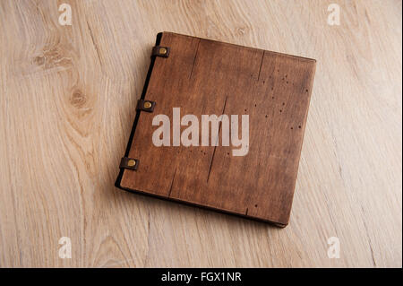 wedding book with a wooden cover on a wooden texture Stock Photo