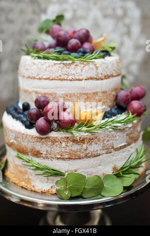 beautiful two-tiered wedding cake on the table Stock Photo