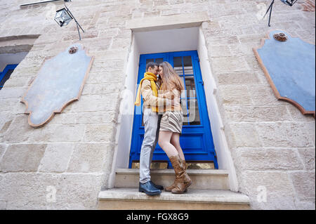 beautiful young couple in love standing near historic building Stock Photo