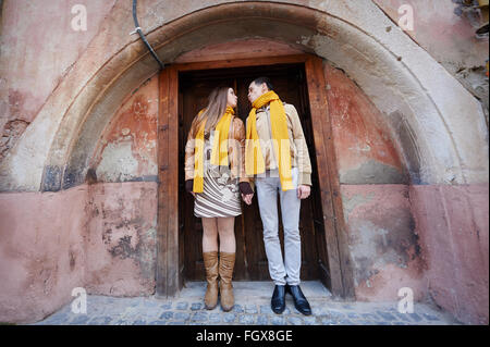 beautiful young couple in love standing near historic building Stock Photo