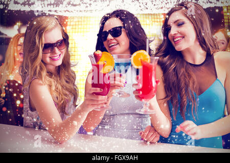 Composite image of friends drinking cocktails Stock Photo