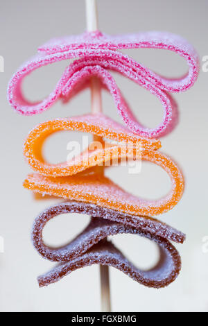 Colorful sugar coated candy skewer with shallow depth of field Stock Photo