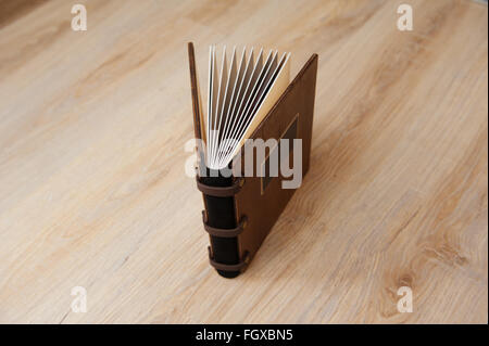wedding book with a wooden cover on a wooden texture Stock Photo