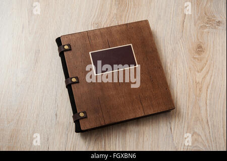 wedding book with a wooden cover on a wooden texture Stock Photo