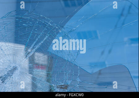 Bullet holes in the window of a shop Stock Photo