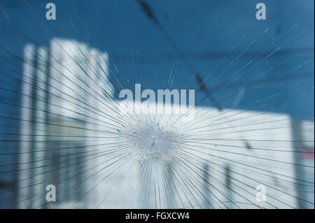 Bullet holes in the window of a shop Stock Photo