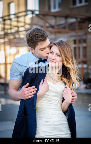 bride and groom are walking in city on wedding day Stock Photo