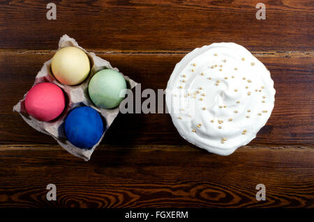 Easter cake with eggs over wooden background from top Stock Photo