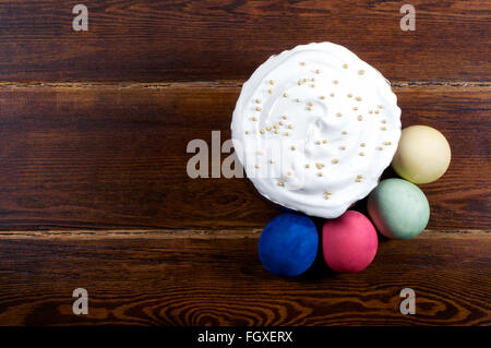 Easter cake with eggs around over wooden background from top Stock Photo