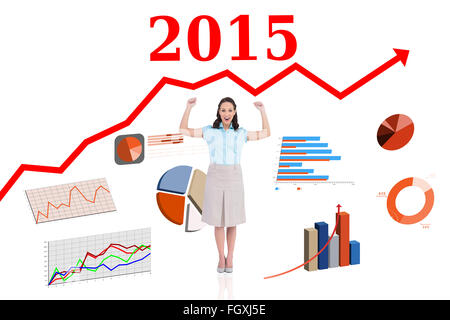 Composite image of victorious stylish businesswoman posing Stock Photo
