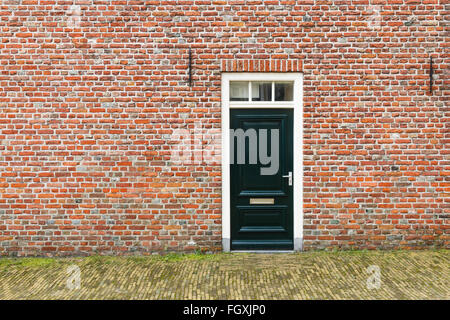 Dutch front door in orange brick facade Stock Photo