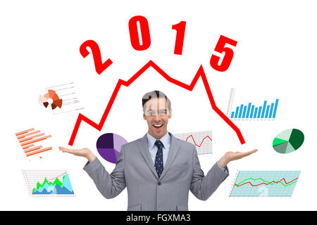 Composite image of smiling businessman presenting something with his hands Stock Photo