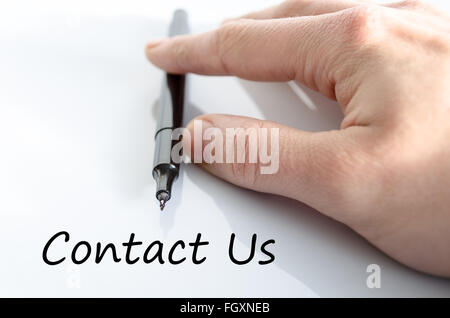 Business man hand writing contact us Stock Photo