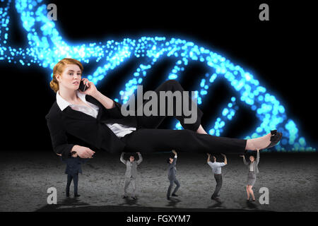 Composite image of business people supporting boss Stock Photo
