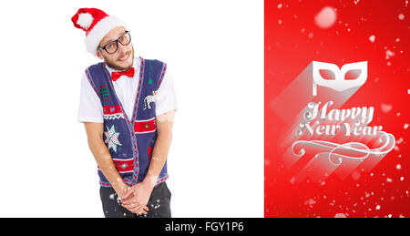 Composite image of geeky hipster in santa hat Stock Photo