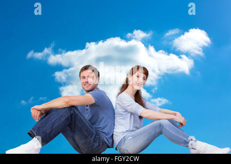 Composite image of couple both sitting on floor Stock Photo