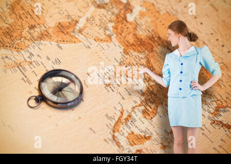 Composite image of pretty air hostess presenting with hand Stock Photo