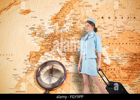 Composite image of pretty air hostess pulling suitcase Stock Photo