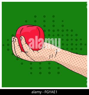 Child's hand holding red apple on green background in pop art style Stock Vector