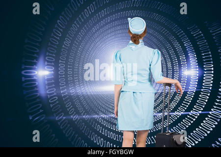 Composite image of pretty air hostess leaning on suitcase Stock Photo