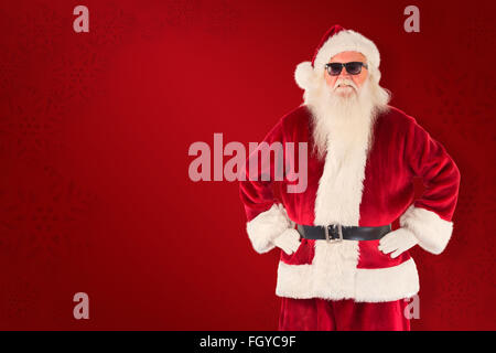 Composite image of santa claus wears black sunglasses Stock Photo