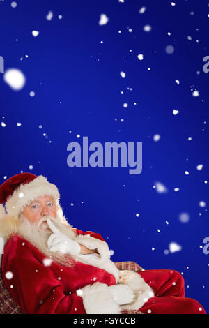 Composite image of santa asking for quiet Stock Photo