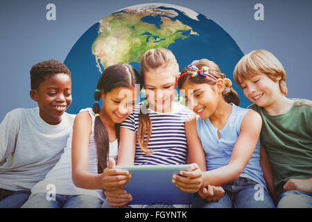 Composite image of children using digital tablet at park Stock Photo