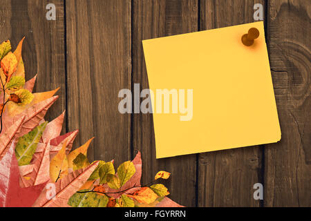 Composite image of yellow pinned adhesive note Stock Photo