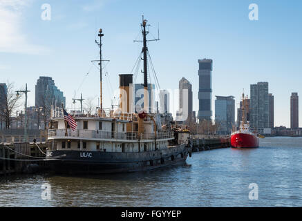 Lilac steam boat docked at Pier 25 in Tribeca on the Hudson River, New York, is an old lighthouse tender ship. Stock Photo